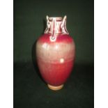 Unusual Chinese Sang de Boeuf vase with three crescent shaped handles, impressed mark 8ins high