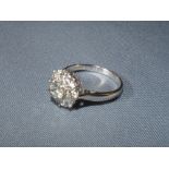 18ct white gold diamond cluster ring, largest to the centre, diamonds approx 1.20 ct.. Size L 1/2