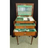 Silver plated 12 setting canteen, by Walker and Hall of Sheffield, in fitted oak case on stand, (one