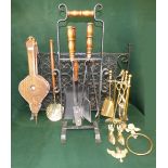 Wrought iron spark guard, various fire irons, pair of bellow, toasting forks and 2 wicker baskets