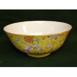 Chinese famille rose yellow-ground bowl, painted with bats amongst flowering branches of peaches and