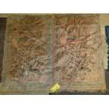 Similar pair of small silk rugs with peach colour back ground and peacock motifs, and floral