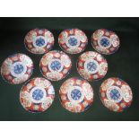 Set of nine late C19th Japanese Imari scalloped edge plates