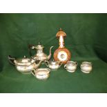 Liberty Tudric pewter 2 piece tea service No. 01075, a silver plated 4 piece tea service and an