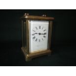 Brass carriage clock (makers mark worn) 11cm high x 8cm long