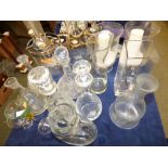 8 assorted glass decanters / carafes, 3 storm lights and assorted glassware