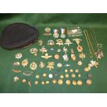 Quantity of mixed military badges and buttons and H.M.S sailors hat