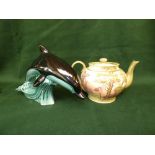 MacIntyre Pottery Cries of London teapot, and a Poole Pottery Dolphin