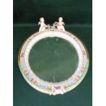 Late C19th Meissen porcelain mirror with cherubic cresting and garland ribbon decoration, 57cm H