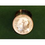 Georgian circular tortoiseshell and gold mounted snuff box, the lid with a classical lady in a