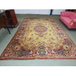 Large English Persian style with mustard coloured ground with floral decoration 340 x 250