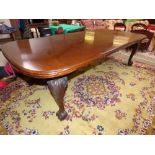 Late C19th mahogany extending dining table with two leaves on carved cabriole legs with claw and