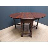 Oak oval drop leaf gate leg dining table on turned supports