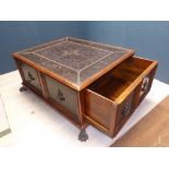 Large mahogany framed coffee table with copper and brass studded decorated top and sides on brass