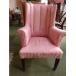 Two wing back armchairs