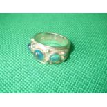 Silver ring set with three cabochon blue topaz in size 'O'