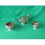 William IV silver three piece tea service, chased foliage, teapot with foliage and reeded spout, the