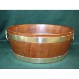 C19th mahogany brass bound oval wine cooler with lion mask ring handles, 60 cm wide