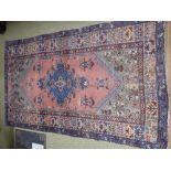 Persian style multi coloured rug with centre motif, 201x127cm