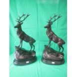 After Moignier, pair of bronzed models of stags on slate bases, 71cm high