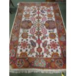 South American style white background rug with multi coloured all over decoration, 267x184cm