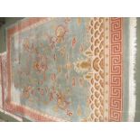 Chinese carpet, the pale blue ground decorated with dragons