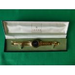 Gents gold plated wrist watch, stamped Gucci in green Gucci watch box