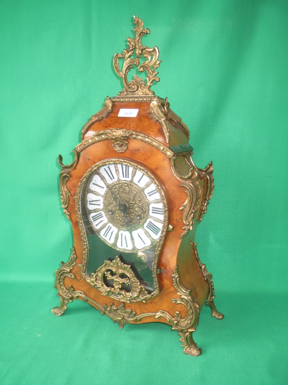 Louis XV style Rococo revival walnut gilt metal mounted mantle clock with German movement