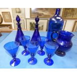 Qty of blue glass ware inc. 5 wine glasses, pair of decanters etc.