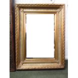 George III style gesso gilt cushion framed oblong wall mirror with reeded swept and foliat frame,