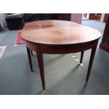 Mahogany extending dining table with D-ends, one with a drop flap on tapering square legs. 105W 183L