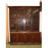 Oak glass fronted bookcase of four doors and four cupboards beneath 188L x 230H