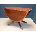 Regency style mahogany and satinwood cross banded drop leaf dining table. 108W