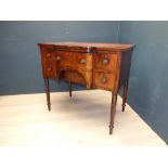 William IV mahogany sideboard with central bow fronted drawer flanked by drawers and a cupboard