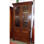 Large glazed top bookcase of two bevelled glass doors with two cupboards below 212cmH