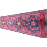 Old Persian runner, pink/terracotta ground with bold geometric pattern 410 cm x 123 cm