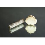 Chinese grey and russet jade cylindrical bead carved with chilong, Ming Dynasty, 6.5cm long;