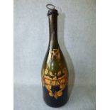 Antique champagne bottle with later gilt decoration as a gin decanter