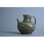 Chinese carved Yaozhou celadon-glazed ewer, the compressed globular body carved with leafy flowering