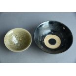 Chinese Henan black-glazed bowl, 16cm diam; together with a molded ‘Yaozhou’ bowl, the interior