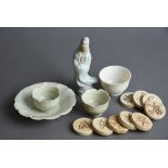 Mixed lot including two Chinese ‘yingqing’ tea bowls and one saucer, a pale blue-glazed figure of