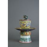 C20th Chinese famille rose trick cup and stand, moulded to the interior with a dragon, and painted