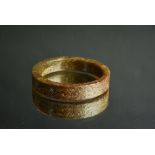 Chinese yellowish green and russet jade bangle, carved with two confronting chilong, Song Dynasty or