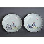 Pair of Chinese famille rose dishes, each painted with a scholar standing beside rockwork and with a