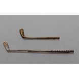 Golf tie pins. Two metal tie pins each in the form of a golf club. One gold metal, 2.25" long, the