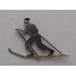 Skiing badge c1920/30s. Art deco style silver metal pin badge, with black colour enamel detail, of a