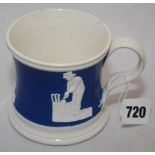 Staffordshire blue ground waisted cricket mug with strap handle and beaded rim. With three relief