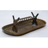 Cricket cigar holder/ ashtray. Brass cigar holder with ends in the form of crossed cricket bats,
