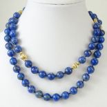 Vintage Lapis Lazuli Bead and Gold Bead Necklace. Unsigned. Lapis beads measure 12mm. Necklace