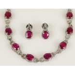 Lady's 21 Large Oval Brilliant Cut Ruby and 14 Karat White Gold Necklace and Earring Suite